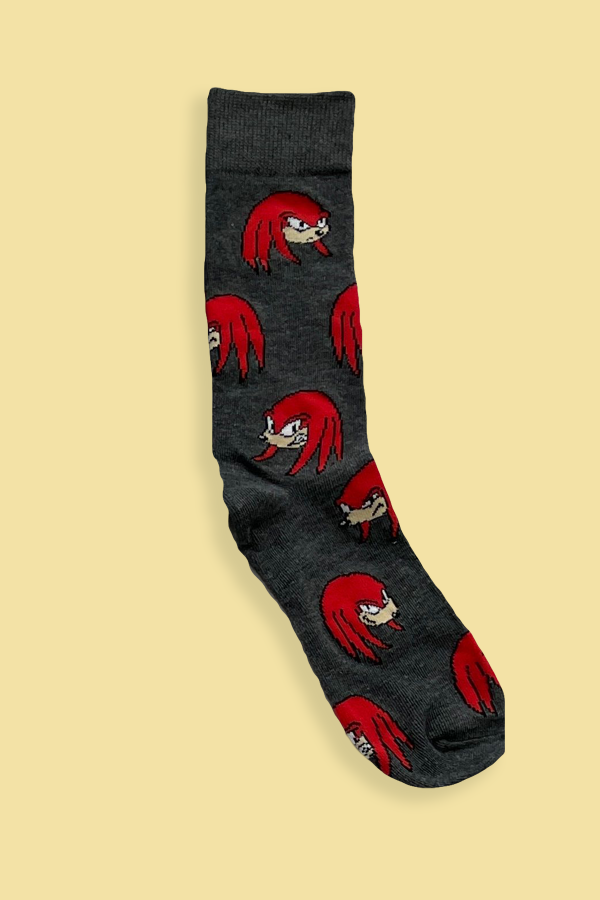 Dark gray sock with red character pattern on a beige background