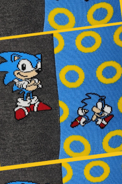 Two pairs of socks with Sonic the Hedgehog design on a checkered background